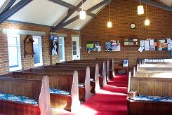 Church 
                        interior pre 2008 showing pews