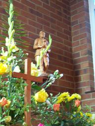 The shepherd looks down on the floral centerpiece